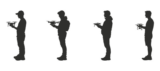 Obraz premium Men operating drones professional silhouettes showcasing technology aerial photography remote control devices