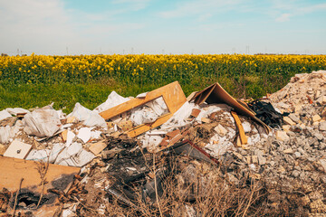 Illegal dumping in cultivated rapeseed field