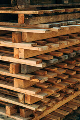 Stacked wooden euro-pallets as industrial background