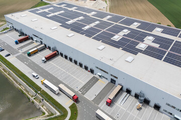Logistics centers with solar panels on roofs. Aerial view