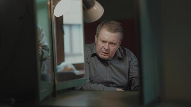 Stressed Man at Work, Overwhelmed by Job, Frustration and depressed.Hand gestures.In a man with bipolar disorder, stress is not the desire to live, it is suicide.