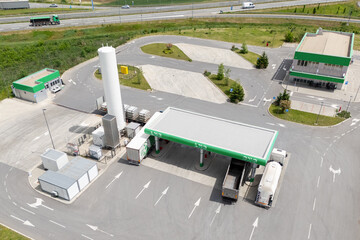 CNG and LPG fueled trucks at a gas station. Aerial view