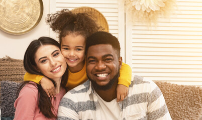 Happy international family hugging and staying at home during epidemic