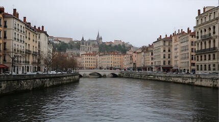 Naklejka premium Charming Lyon canal scene, Trévoux waterways, city buildings, hilltop Gothic cathedral, overcast sky, France