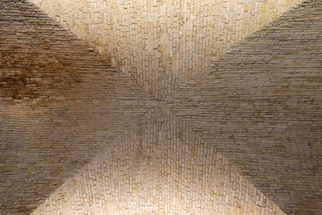 Brick groin vault ceiling forming star pattern