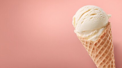  Ice cream cone with vanilla scoop on pink background with copy space