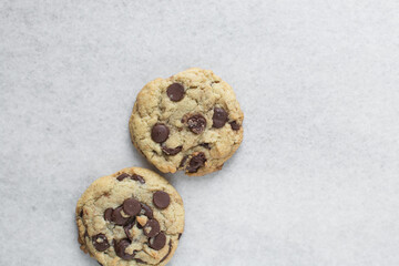 Overhead view of chocolate chip cookies, top view of homemade chocolate chip cookies on a white background