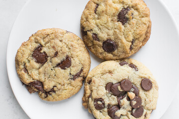 Overhead view of chocolate chip cookies, top view of homemade chocolate chip cookies on a white background