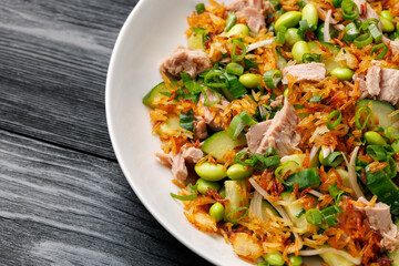Crispy Rice Tuna Salad with edamame beans, cucumber, onion