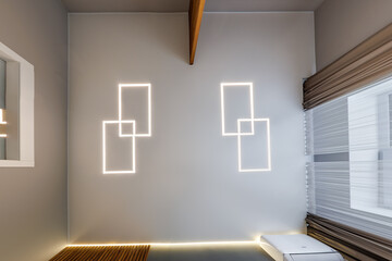 suspended ceiling with halogen spots lamps in form of squares and rectangles and drywall...