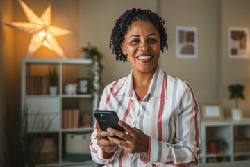 mature african american woman use mobile phone in the living room