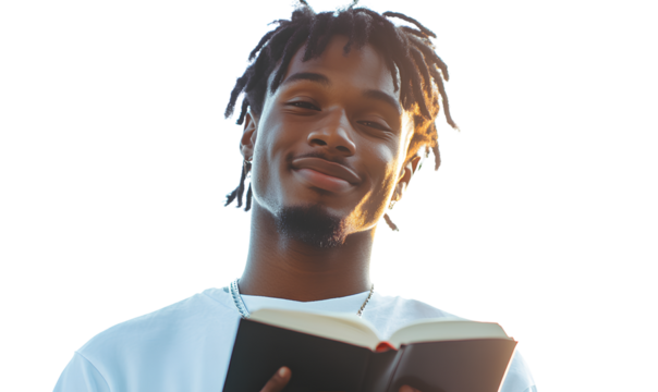 Male student smiling and holding a book against a transparent background with no shadow, on a white background.