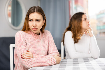 Two sisters do not want to communicate after a domestic quarrel at home