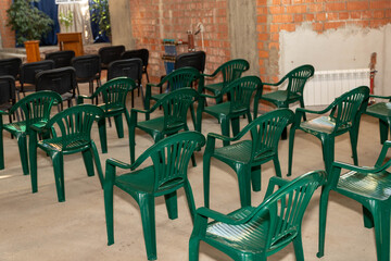 Green plastic chairs in the stadium.