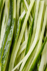 Macro Shot of Freshly Cut Cucumber Sticks.
Close-up view of green cucumber sticks cut into even strips, showing juicy texture and vibrant freshness, ideal for salads or sushi prep.