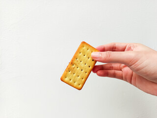 Crispy chocolate-filled biscuit with a perfect bite, held in hand—ideal for snack branding, dessert promotions, or food product advertising