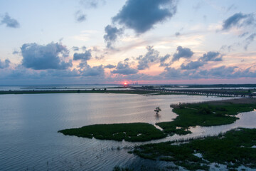 Fototapeta premium Aerial view of Mobile Bay at sunset in April