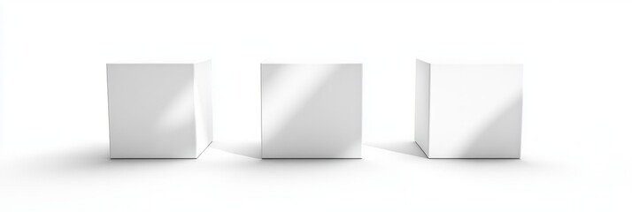 Obraz premium Three white cubes evenly spaced in a bright white environment with soft shadows and smooth surfaces