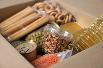 Many different food products in box, closeup