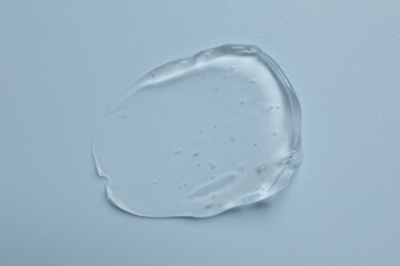 Collagen gel on light blue background, top view