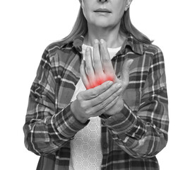 Arthritis. Senior woman suffering from pain in hand on white background, closeup. Black and white...