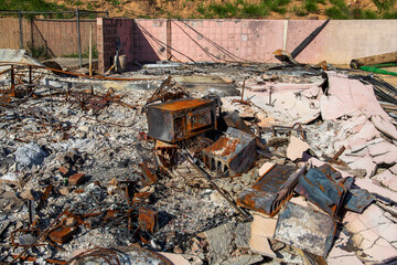 burned debris at home destroyed in the Altadena wildfires on Loma Alta Drive in Altadena California USA