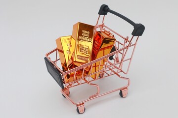 Pile of gold bars in a shopping cart