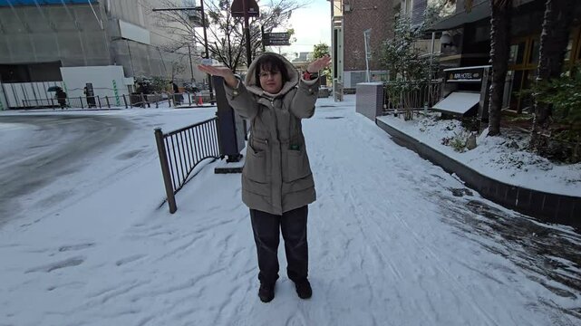 Girl wearing snow clothes in winter setting