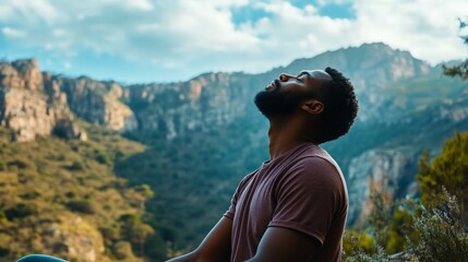 Naklejka premium Young african american man practices mindful meditation in nature