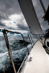 Sailing Yacht on Rough Sea Under Stormy Sky , Ocean Adventure Perspective