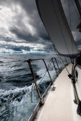Sailing Yacht on Rough Sea Under Stormy Sky , Ocean Adventure Perspective