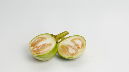 a slice fresh eggplant on a white background ready for cooking. healthy food for diet. gardening plants
