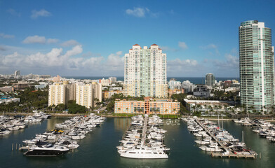 Obraz premium Port with yacht. Yachting marina. Luxury yacht charter. Miami port marina. Luxury yachting in summer. Docked yacht in port of Miami. Marina luxury cityscape. Docked boats at marina