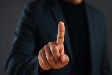 Businessman touching invisible screen with index finger