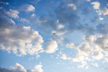 Photo of the blue sky with an airplane in the middle