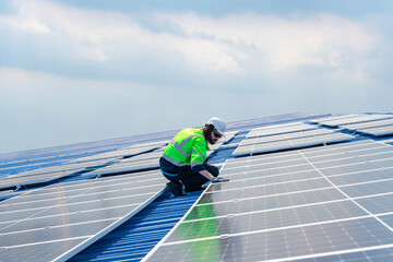 Fototapeta na wymiar Engineer service check installation solar cell on the roof of factory , Sustainable energy industry concept, Renewable energy solution for climate change