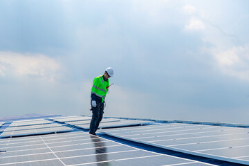 Engineer service check installation solar cell on the roof of factory , Sustainable energy industry concept, Renewable energy solution for climate change..
