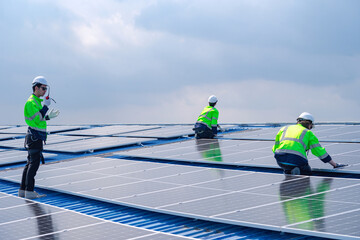 Engineer team installs solar cells check installation solar cell on the roof Sustainable energy industry concept Renewable energy solutions for climate change
