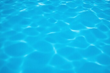 close up of a blue swimming pool with water ripples