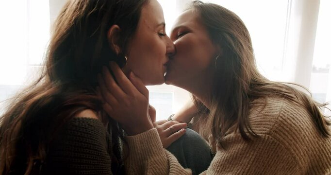 The girls look into each other's eyes and smile beautifully. sweet kiss. Close up look at face. Look in the eyes in love. Love and kiss, Romance and portrait of lesbian couple enjoying. LGBT rights,