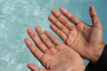 Wrinkled hand because of soak in the water for a long time