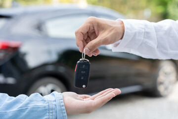 lease, rental car, sell, buy. Dealership manager send car keys to the new owner.  Sales, loan credit financial, rent vehicle, insurance,  renting, Seller, dealer, installment, car care business.