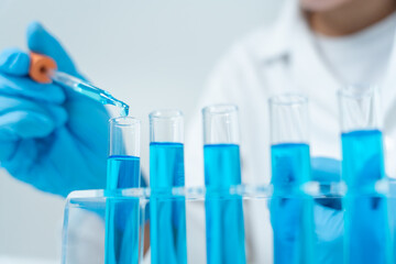 Scientist analyze biochemical samples in advanced scientific laboratory. Medical professional use dropper mix microbiological developmental of viral. Biotechnology research in  science lab. cosmetic