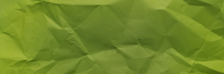 Crumpled green paper background. 