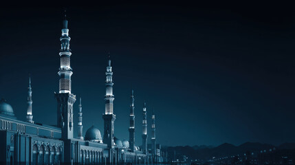 Fototapeta premium Majestic mosque at night, illuminated minarets against a dark sky, showcasing architectural details and serene ambiance