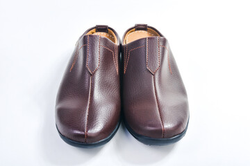 Brown leather slippers isolated on white background