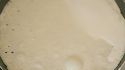 Delightfully Freshly Cooked Batter Being Expertly Prepared in a Pan for Your Ultimate Enjoyment