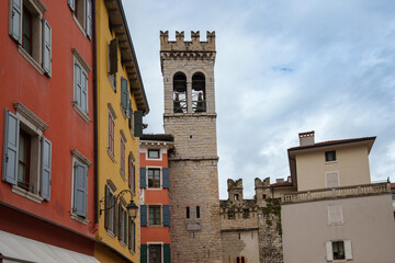 Tower Gate of San Michele in the old town of Riva del Garda, Trentino, Italy. It serves the triple function of gate, town tower, and bell tower of the Church of Santa Maria Assunta.