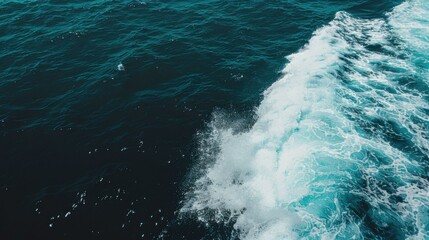 Naklejka premium Aerial View of a Breaking Wave in the Deep Blue Ocean: Turquoise Water and 