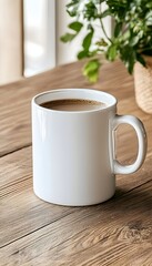 A white ceramic mug filled with coffee sits on a wooden table, with a green plant and sunlight in the background